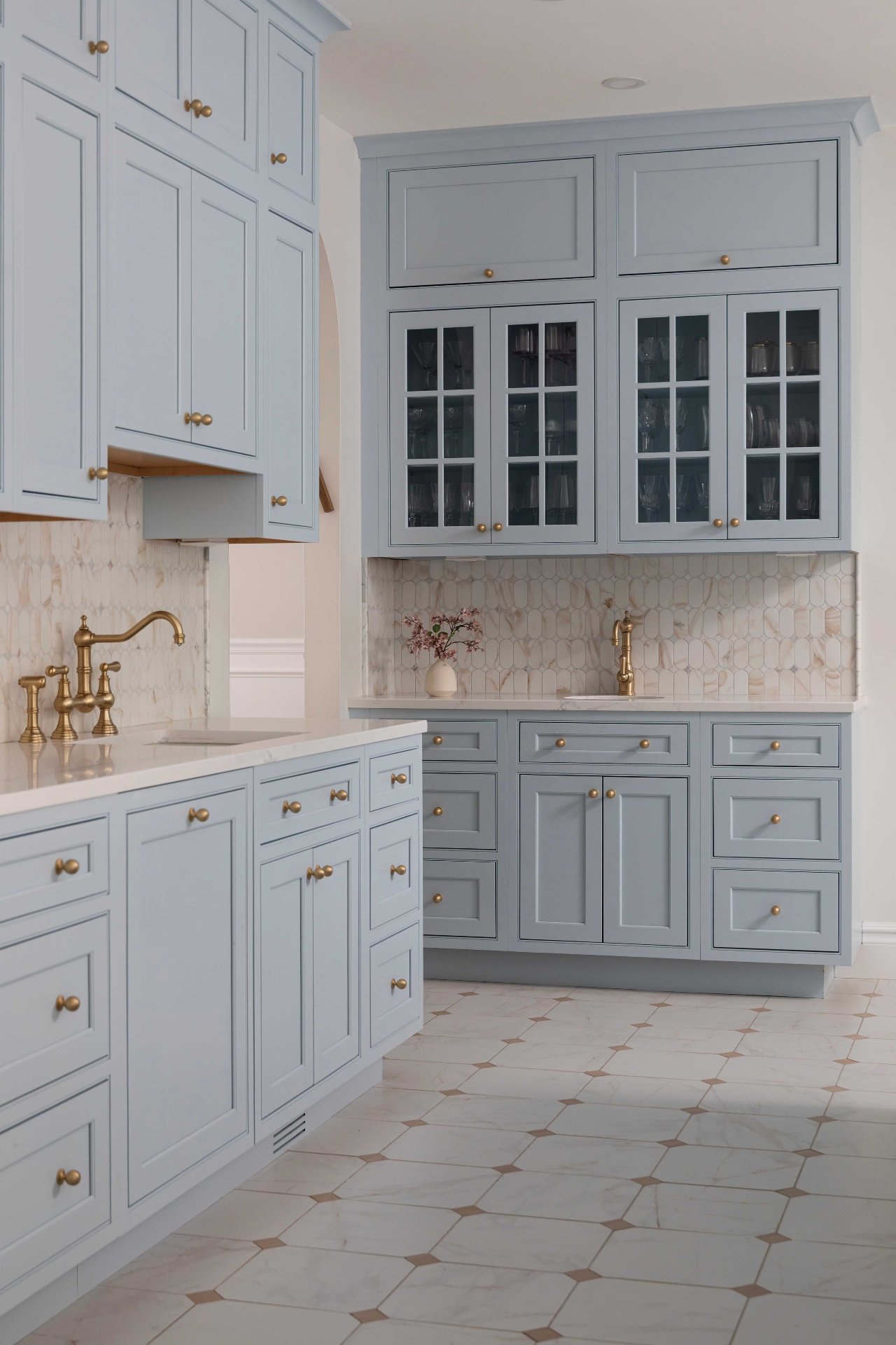 Built-in hutch with glass uppers, prep sink and stacked drawer banks
