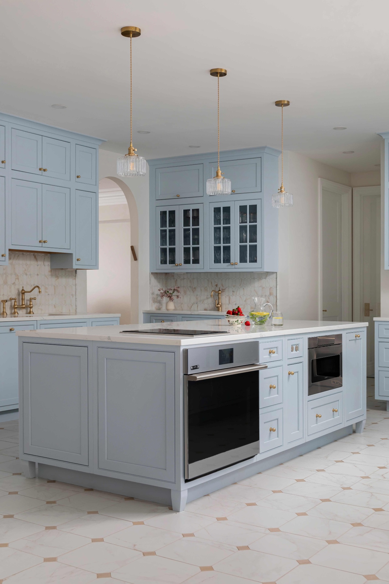 Island with built-in wall oven, induction cooktop and warming drawer